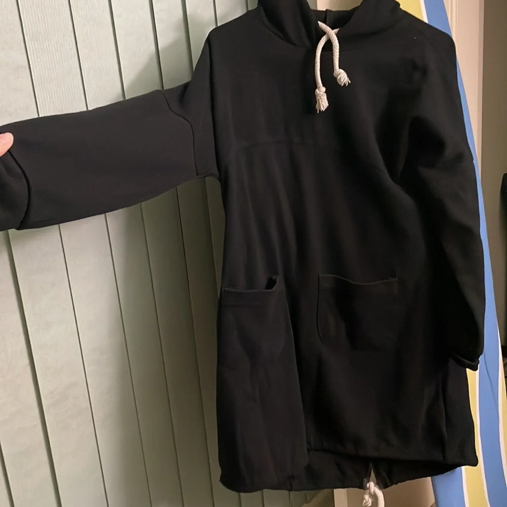 That is a sweatshirt. It is long and very black. - Picture 2 of 4